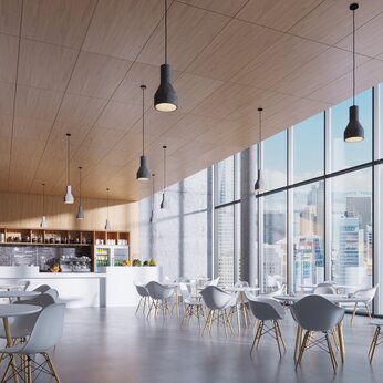 Office Cafeteria Setting Using Armstrong WOOD Lay-In Vector Ceiling Solution with Oak Veneer From Knauf Ceiling Solutions